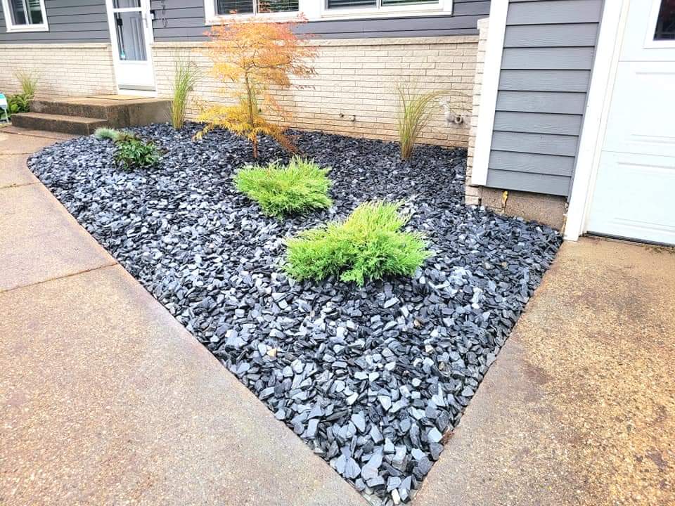 Black decorative rock landscape bed, West Michigan