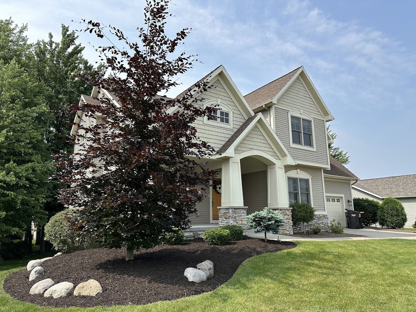 Mulch bed with boulders and Japanese maple, Grand Rapids MI