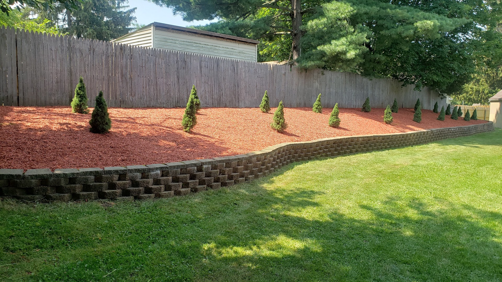 Red mulch bed and retaining wall, West Michigan